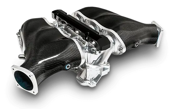 A sleek carbon fiber intake manifold with polished aluminum accents, designed for high-performance automotive engines.